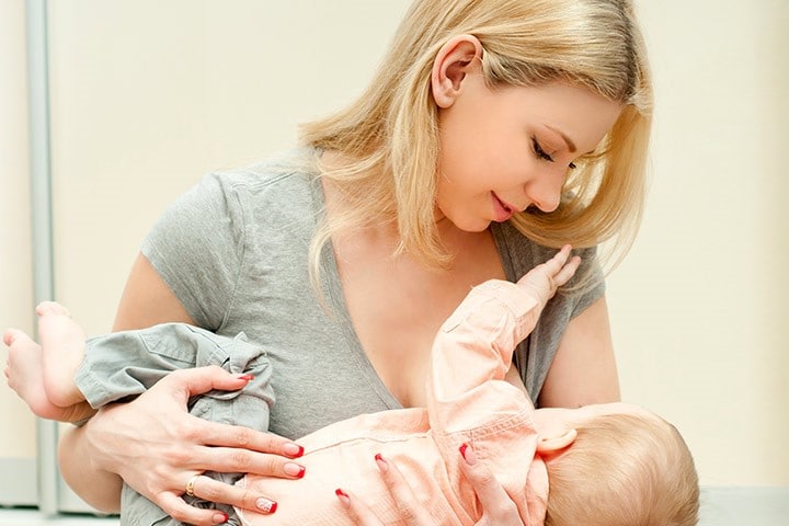 Mother breast feeding her infant