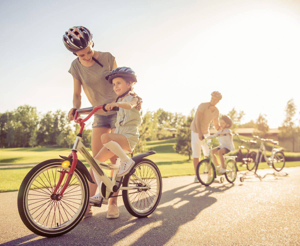 parent and child riding bike