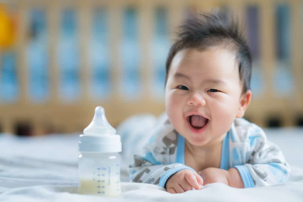 asian newborn baby smile milk power