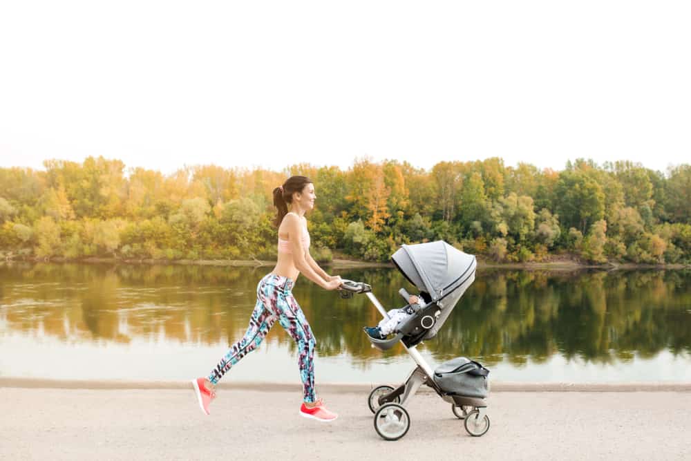 mother jogging with jogging stroller