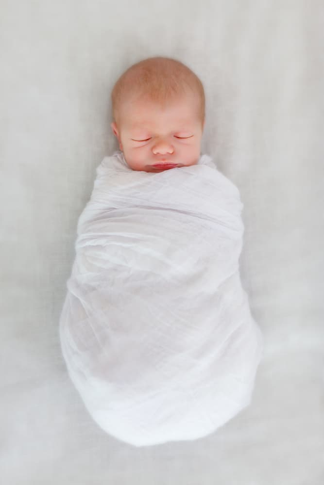 a swaddled newborn