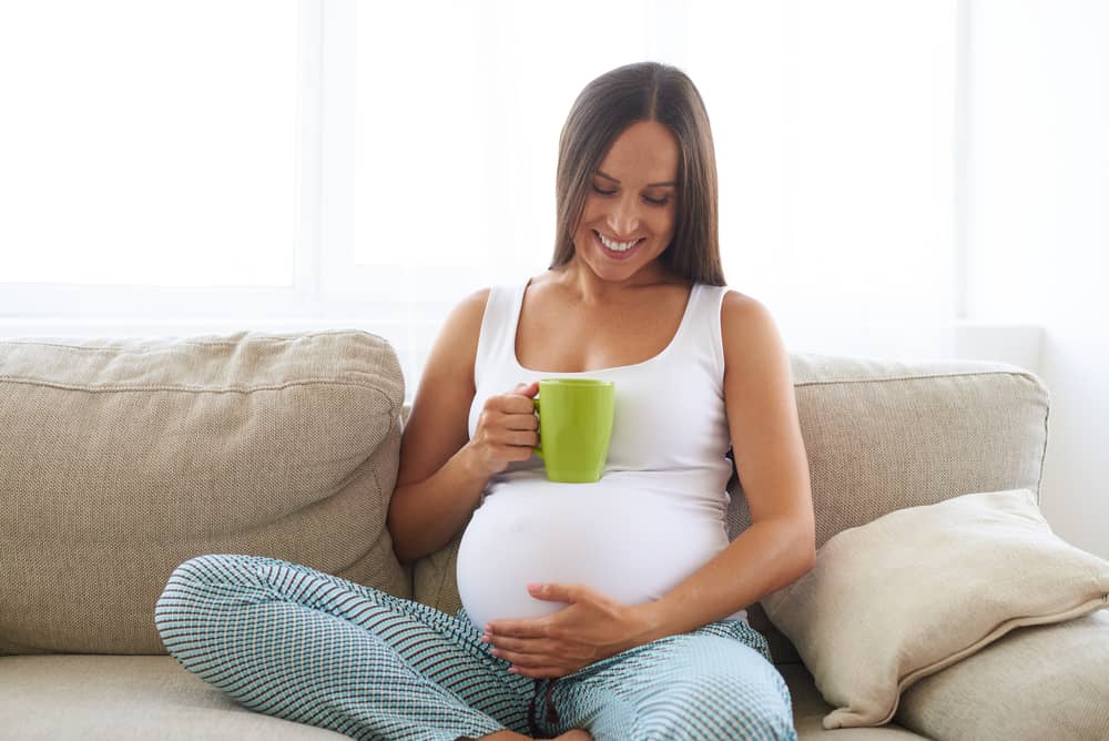 pregnant woman drinking herbal tea