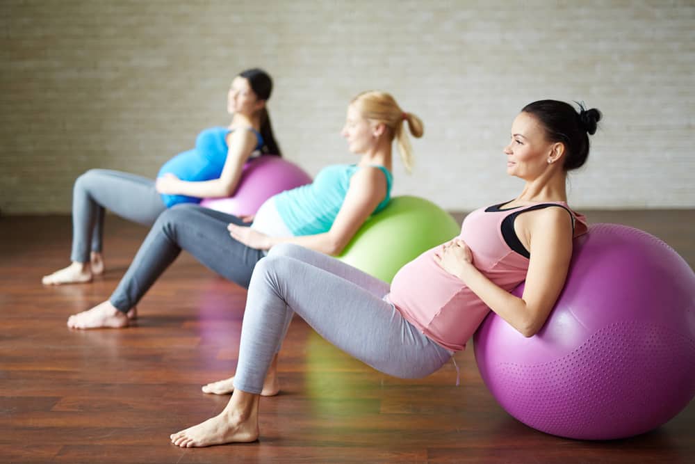 pregnant women exercising on fit balls