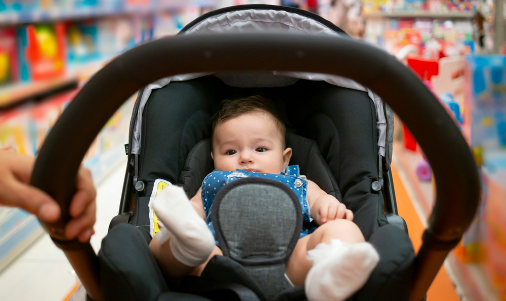 Baby in a stroller in a grocery store