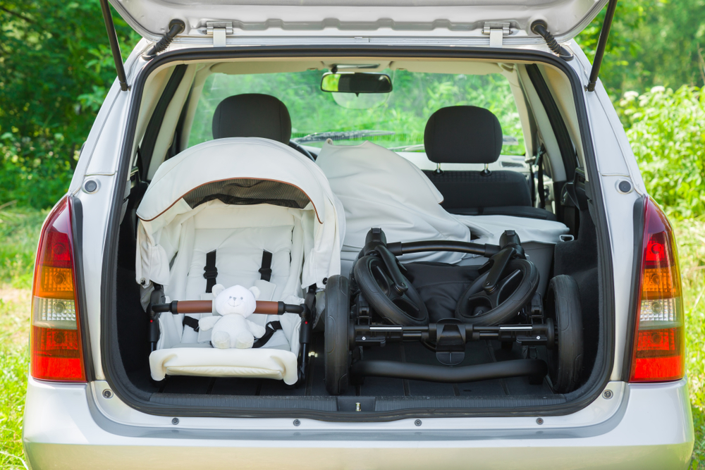 Disassembled stroller in SUV’s open trunk